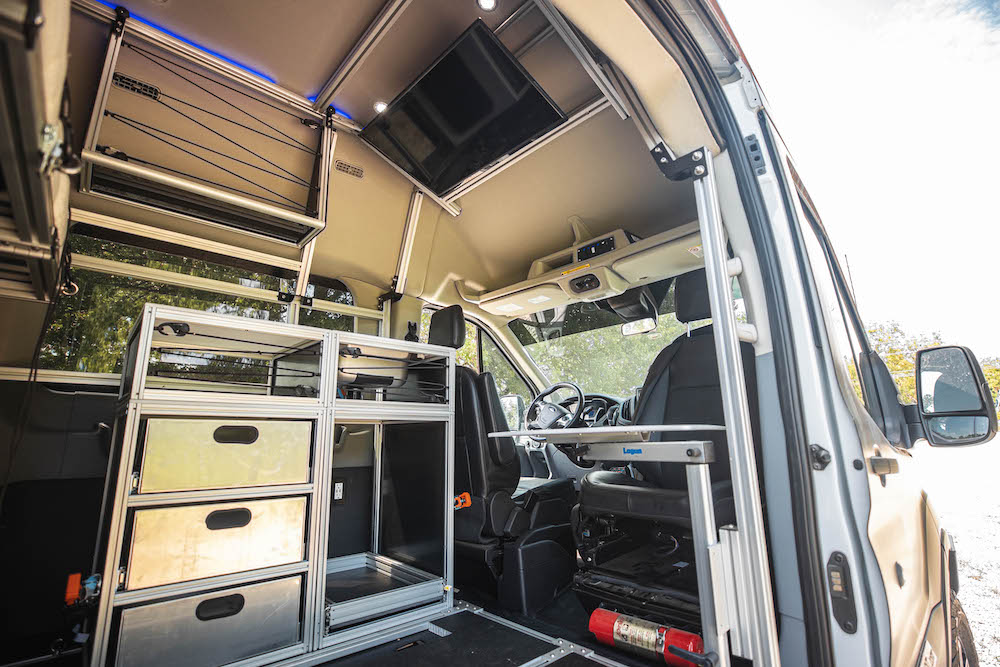 Set up for 2 person seating. The cabin area is open for kitchen modules and other gear.