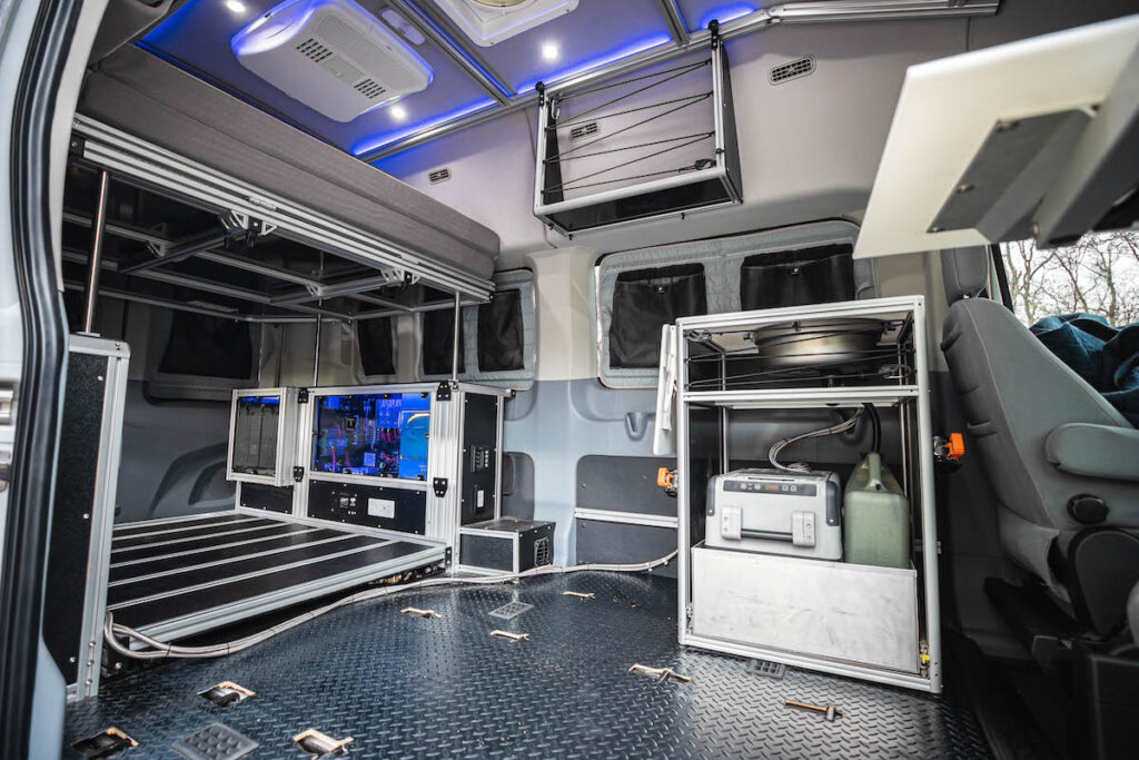 Set up for 2 person seating. The cabin area is open for kitchen modules and other gear.